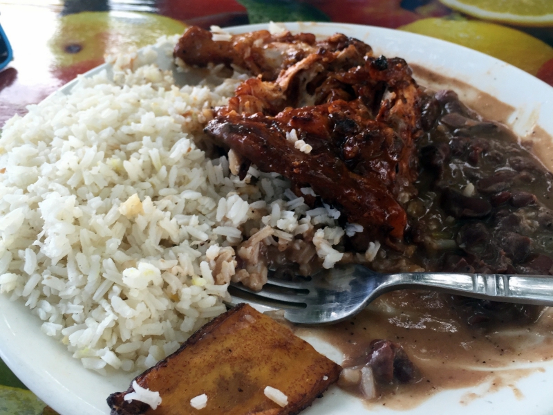 A classic Belizean dish of stewed beans with chicken, rice, and friend plantains. 
