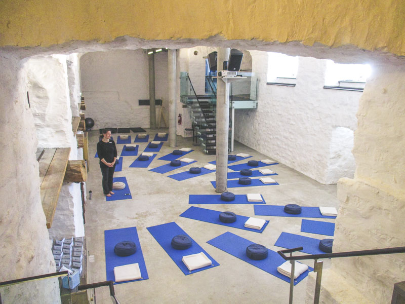 yoga practice in the renovated basement of the monastery