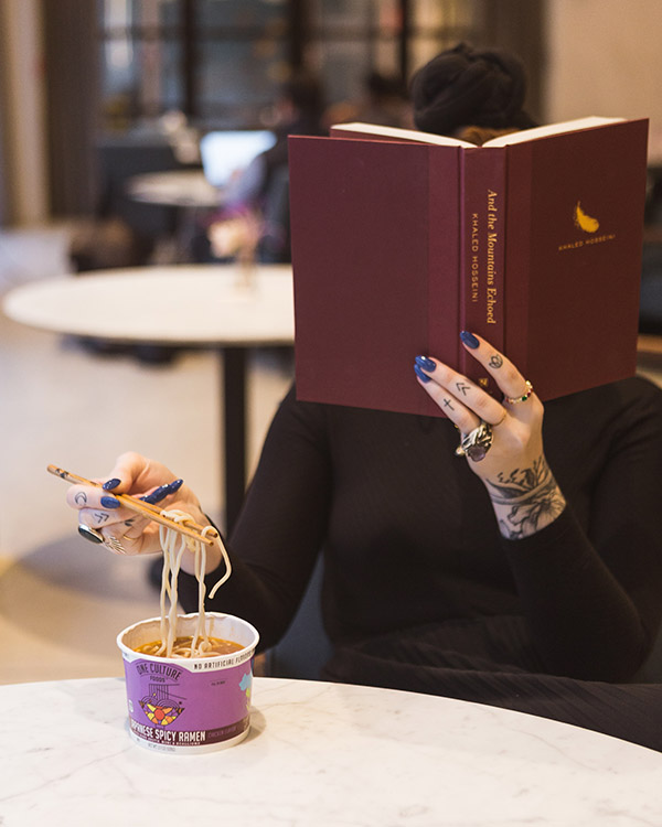 solo dining with a book for entertainment