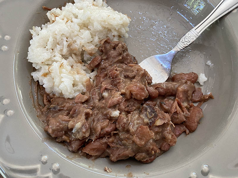 Homemade Belizean stewed beans with a side of coconut rice