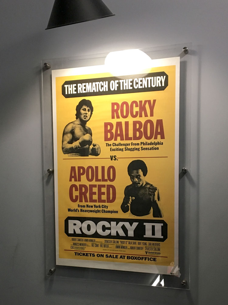 Rocky II movie poster in the hallway of the hostel.